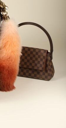 * LOUIS VUITTON.
Sac à main Damier, toile...