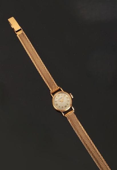 JUVENIN.
Montre de dame en or jaune 750 ‰,...