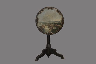 Circular pedestal table in blackened wood,...
