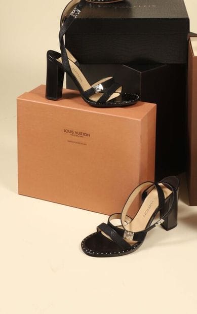 LOUIS VUITTON.
Pair of black leather sandals...