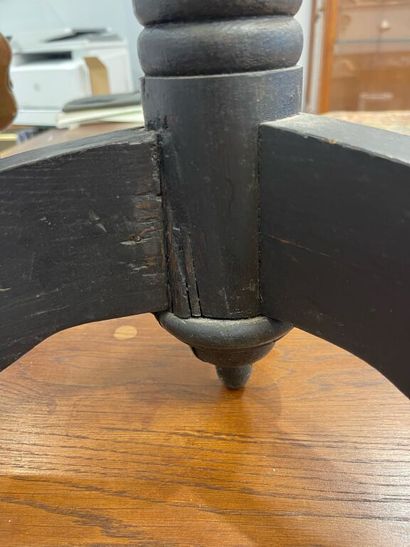 Circular pedestal table in blackened wood,...