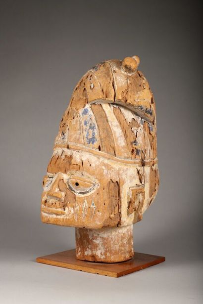 Large head (probably a statue) of a man wearing...