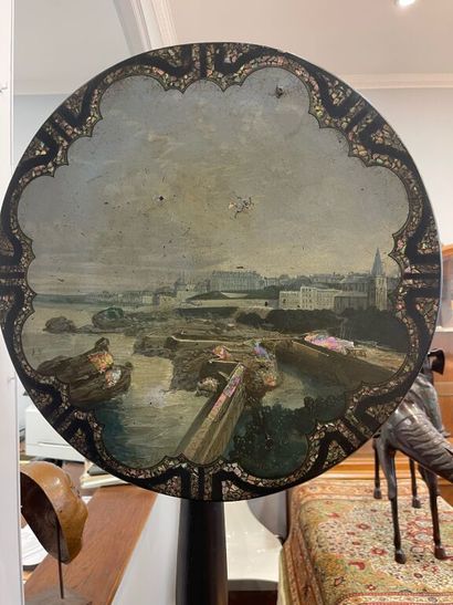 Circular pedestal table in blackened wood,...