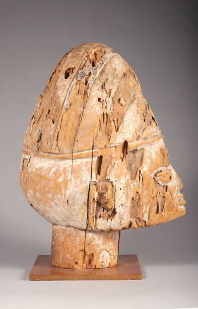 Large head (probably a statue) of a man wearing...