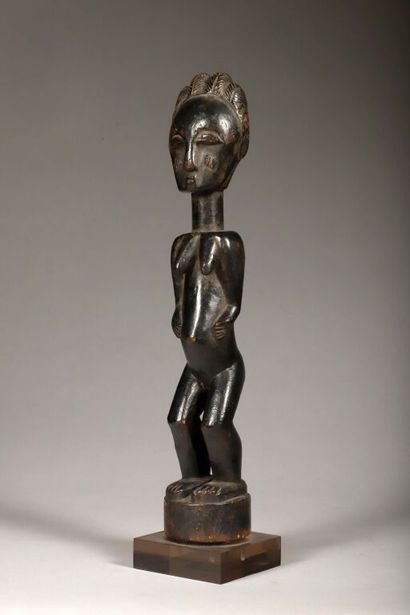 Standing female statue. Wood with black lacquered...