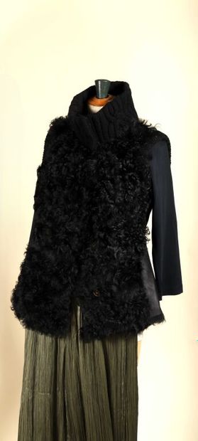 ESCADA.
Sleeveless turtleneck cardigan in...