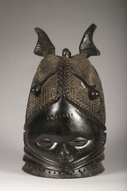 Sowei helmet mask depicting a young woman...