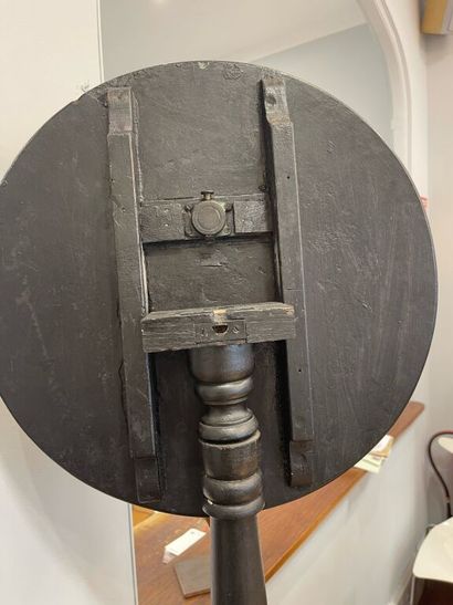 Circular pedestal table in blackened wood,...