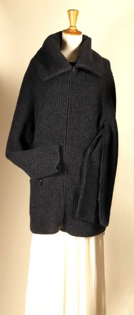 CHANEL by Karl LAGERFELD.
Ribbed vest with...