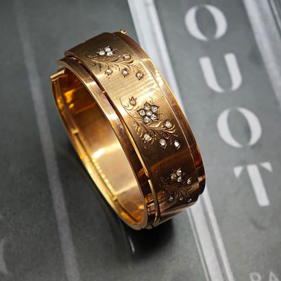 BRACELET rigide ouvrant en or jaune 750‰...