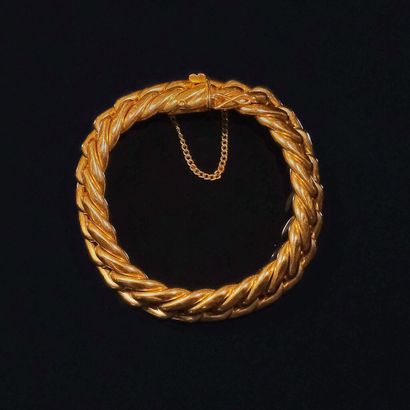 BRACELET en or 750 ‰ à maille gourmette....