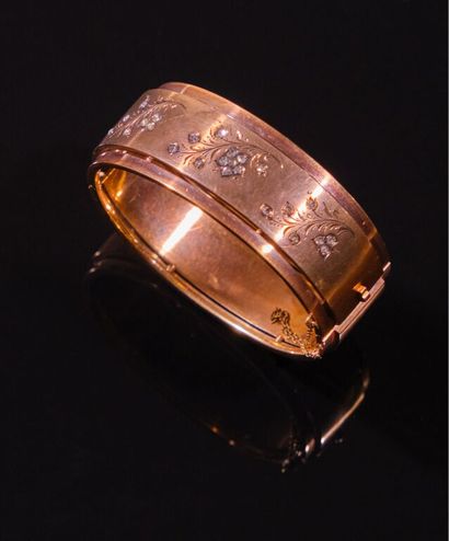 BRACELET rigide ouvrant en or jaune 750‰...