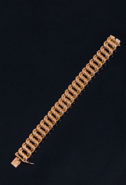 BRACELET en or jaune 750‰ à maille américaine....
