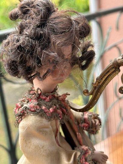 Small harp-playing automaton with bisque...
