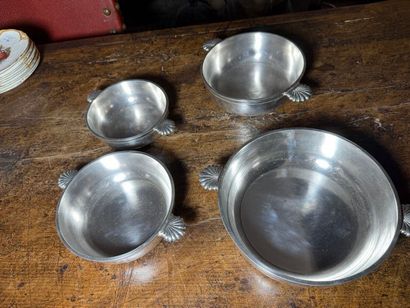 Suite of four bowls, the handles decorated...