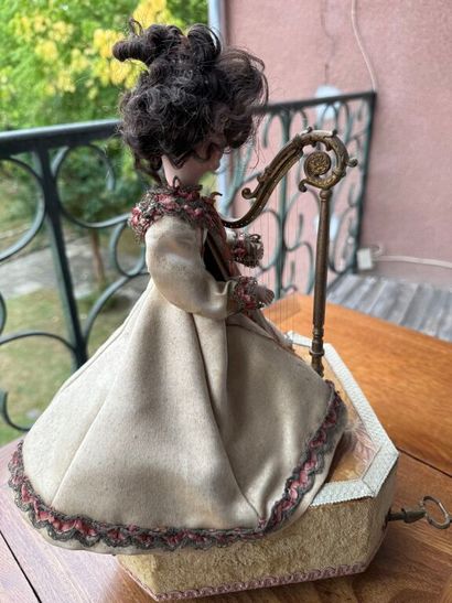 Small harp-playing automaton with bisque...