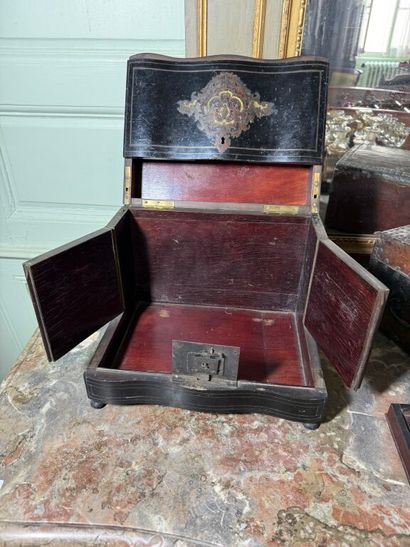 Liqueur cellar in partly black-stained mahogany...