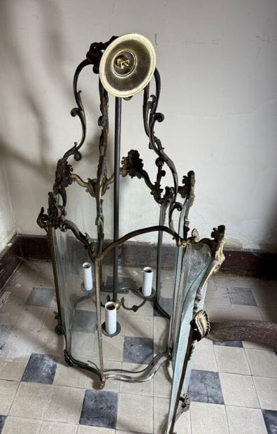 A large three-armed cage chandelier in molded...