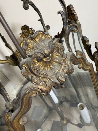 A large three-armed cage chandelier in molded...