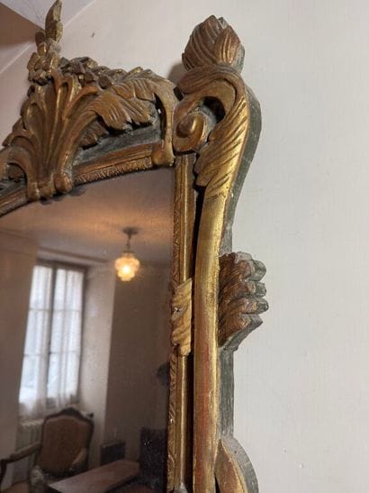 Large mirror in carved wood, gilded and green...
