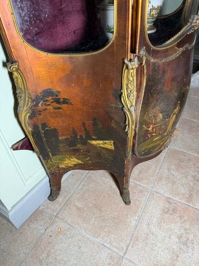 A veneered wood display case, decorated in...