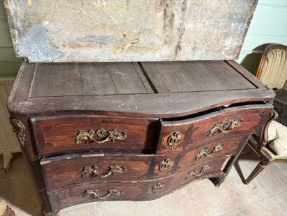 An important chest of drawers with a curved...