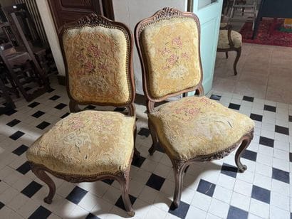 Pair of molded and carved wood chairs decorated...
