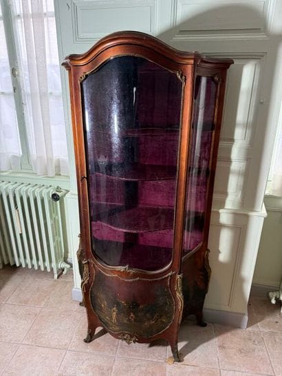 A veneered wood display case, decorated in...