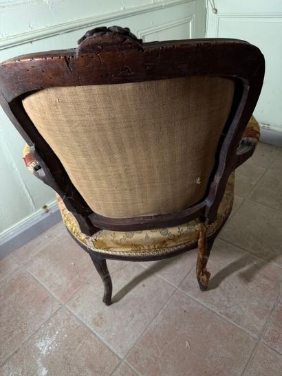 Natural wood armchair, molded and carved...