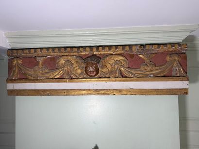 Carved wood paneling with ochre and white...