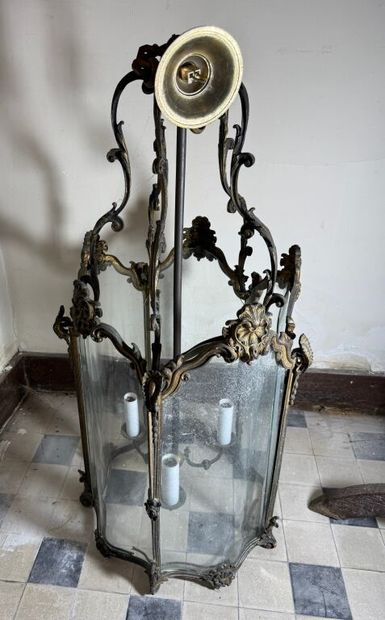 A large three-armed cage chandelier in molded...
