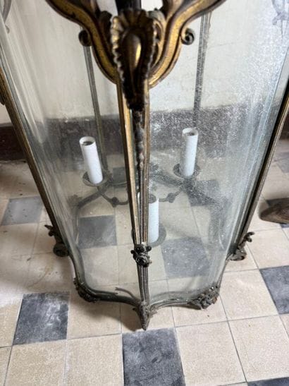 A large three-armed cage chandelier in molded...