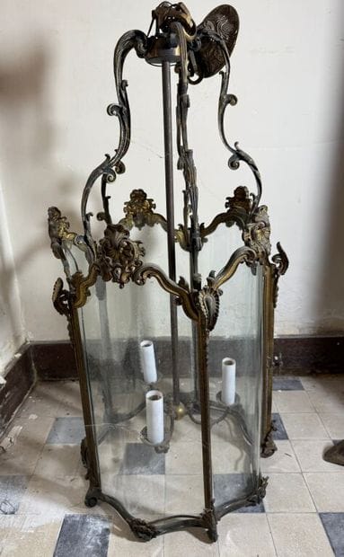 A large three-armed cage chandelier in molded...