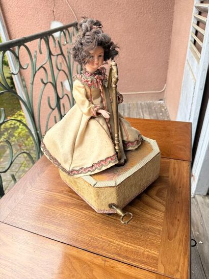 Small harp-playing automaton with bisque...