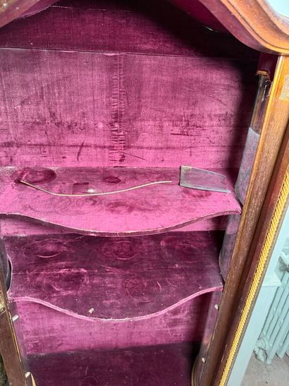 A veneered wood display case, decorated in...