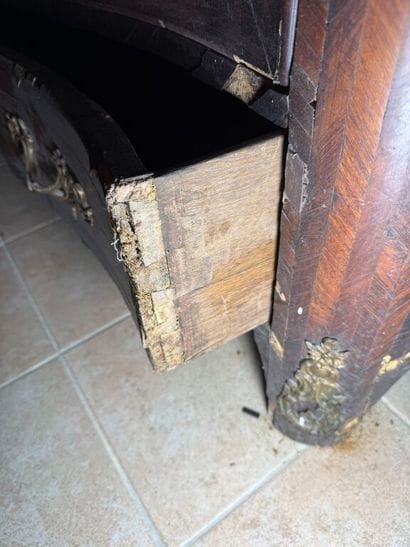 An important chest of drawers with a curved...
