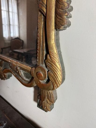 Large mirror in carved wood, gilded and green...