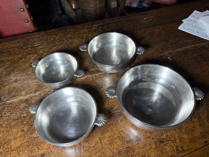 Suite of four bowls, the handles decorated...