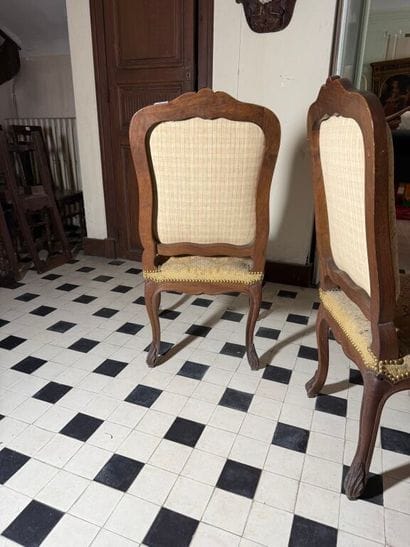 Pair of molded and carved wood chairs decorated...
