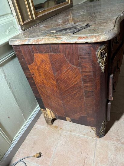 An important chest of drawers with a curved...