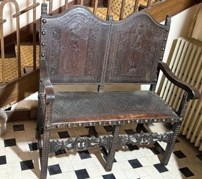Double armchair forming a bench in carved...