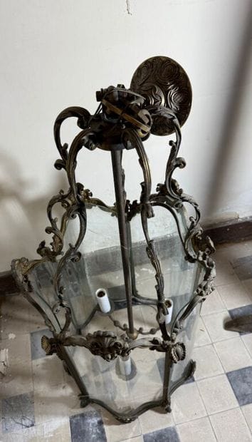 A large three-armed cage chandelier in molded...