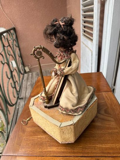 Small harp-playing automaton with bisque...
