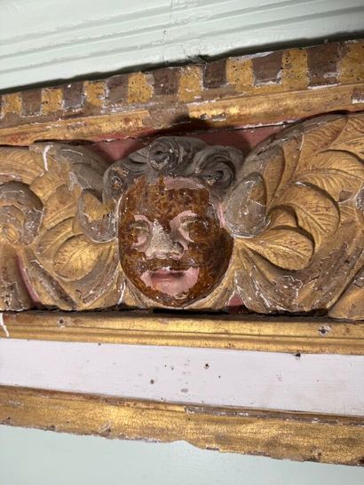 Carved wood paneling with ochre and white...