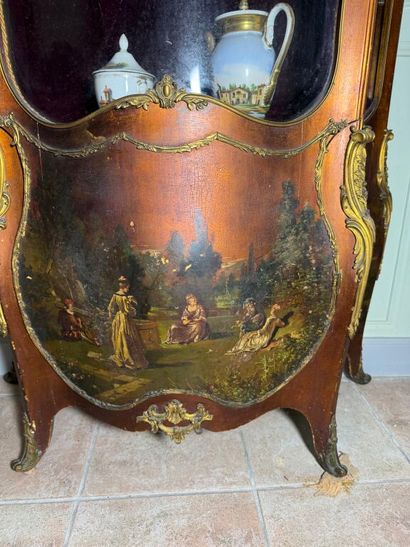 A veneered wood display case, decorated in...