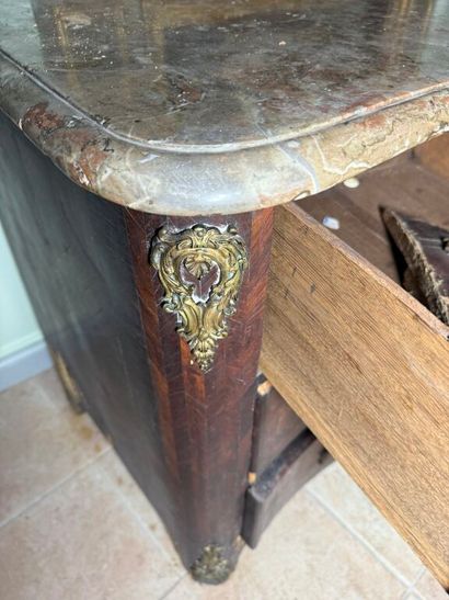 An important chest of drawers with a curved...