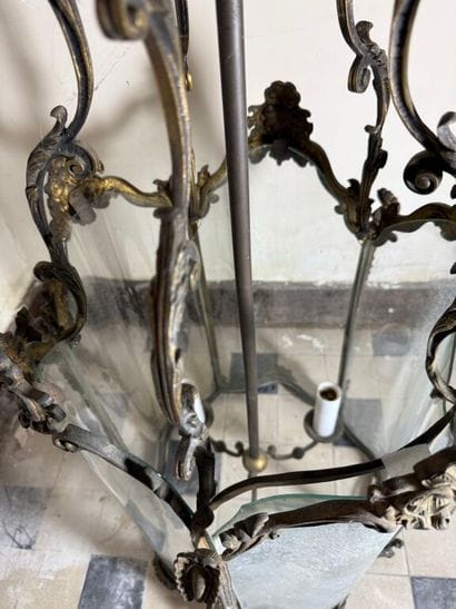 A large three-armed cage chandelier in molded...