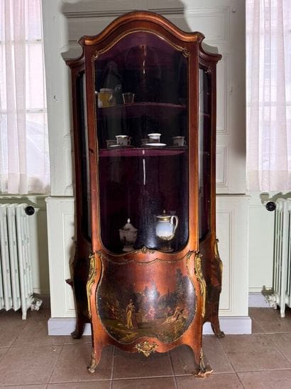 A veneered wood display case, decorated in...