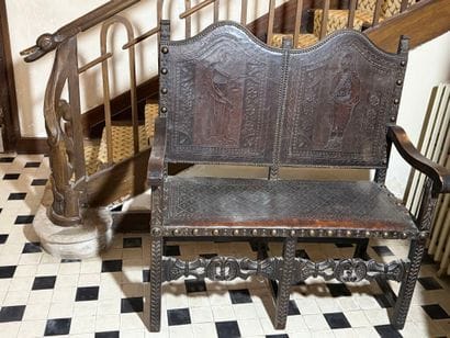 Double armchair forming a bench in carved...