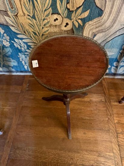Set of two pedestal tables: 
- one in mahogany...